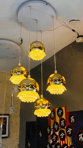 Golden Aura Ceiling Light Modern ঝাড়বাতি -ঘরের আধুনিকতার আলোয় বদলে দিন এক্সক্লুসিভ ঝাড়বাতির স্পর্শে(Transform your home into a modern space with the touch of an exclusive chandelier)